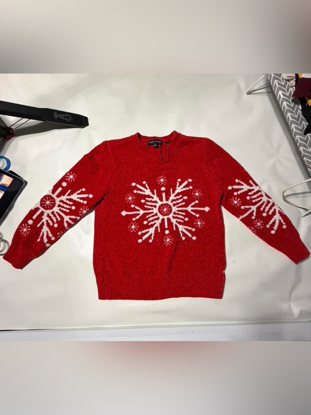 Red snowflake sweater with white accents